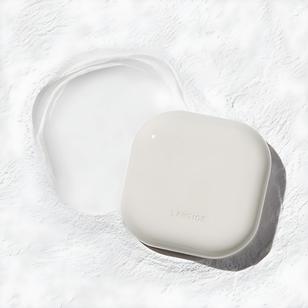 a white Laneige Neo Essential Blurring Finish Powder laying on top of a white surface