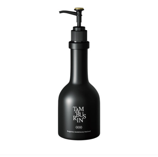 A bottle of TAMBURINS Perfumed Hand&Body Wash with the word "Tami Kinn" on it.
