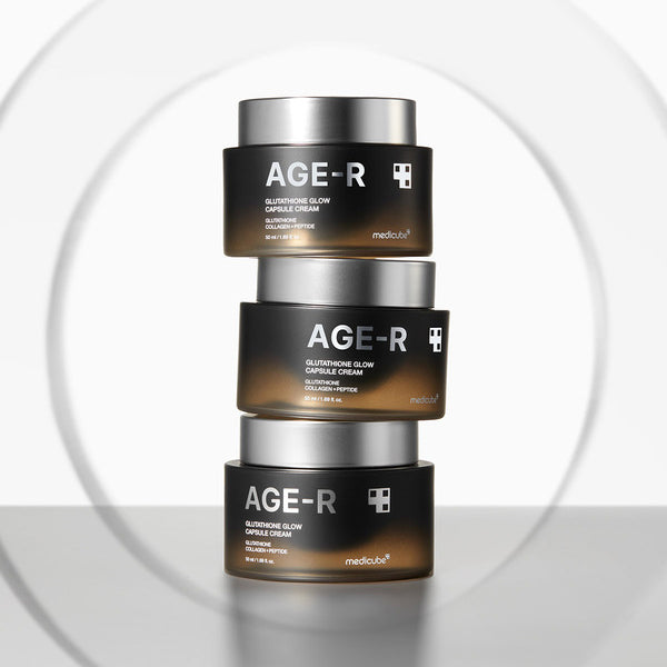 three jars of age - r are stacked on top of each other