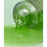 a close up of a bottle of green liquid