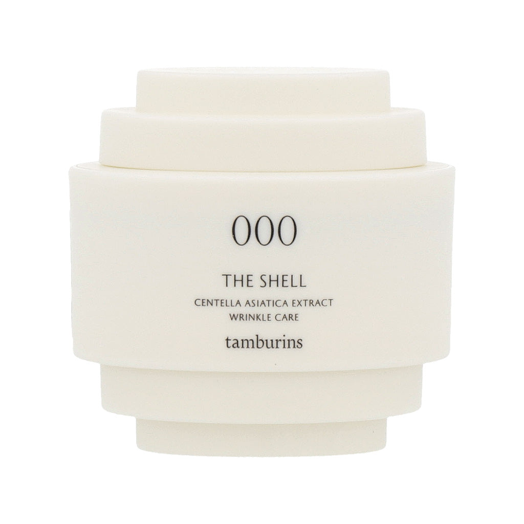 A white container with cream inside, labeled 'TAMBURINS THE SHELL Perfume Hand 15ml'