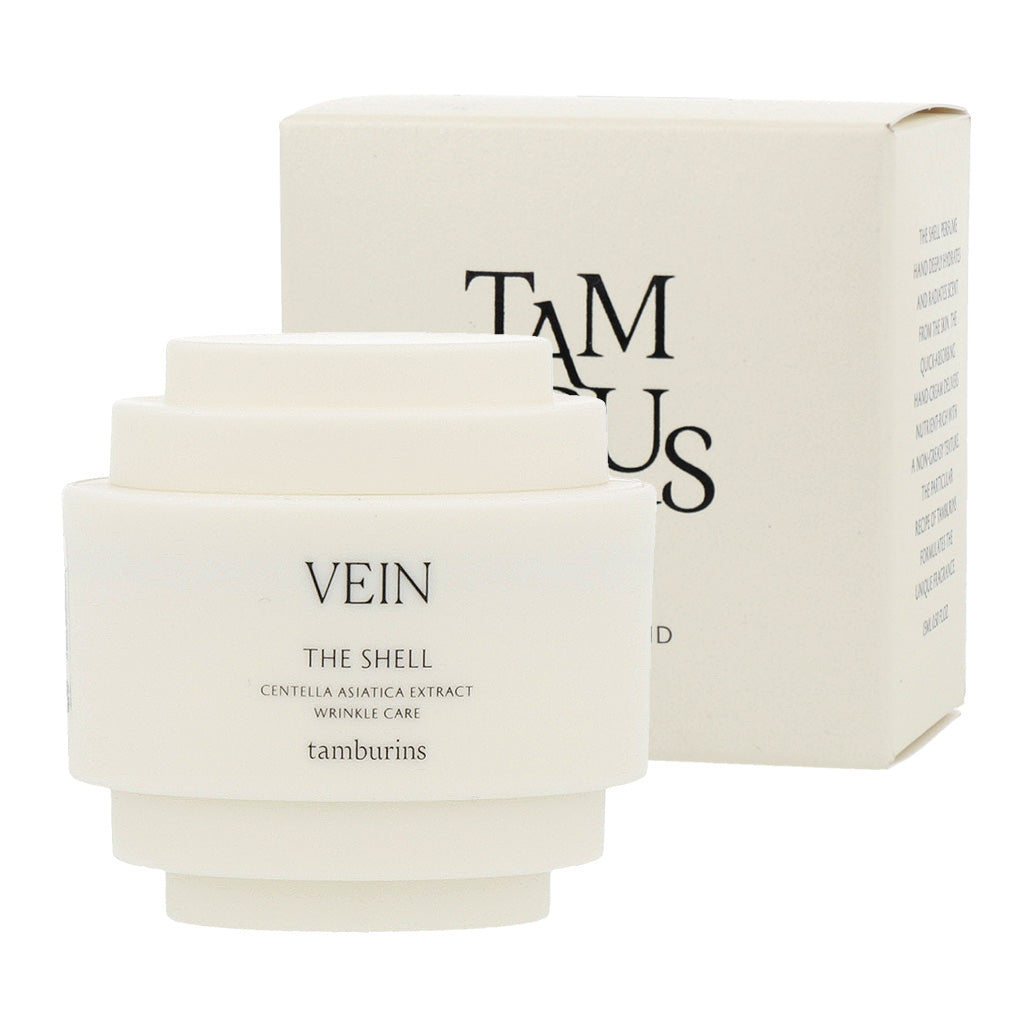 Cream-colored shell design on a white 30ml container of TAMBURINS THE SHELL Perfume Hand. #VEIN