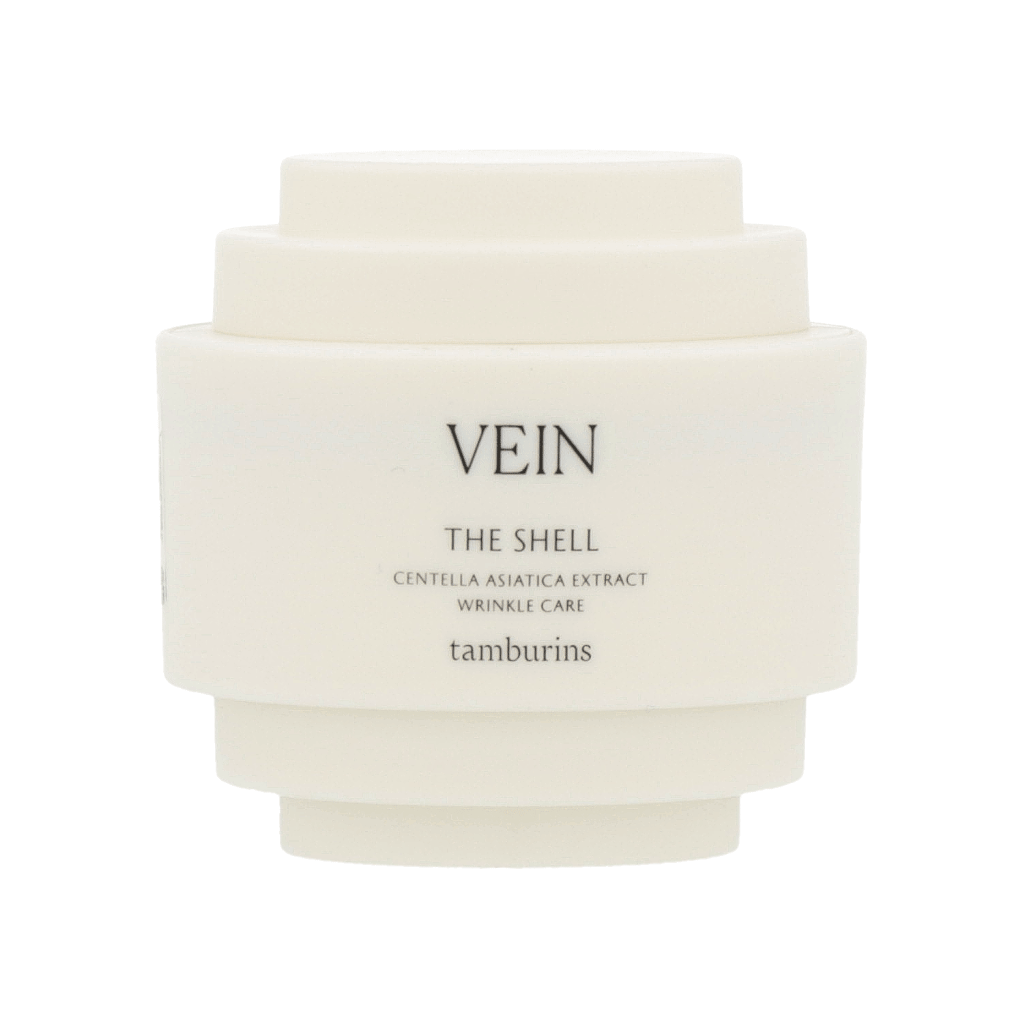 Cream-colored shell design on a 30ml white container of TAMBURINS THE SHELL Perfume Hand. #VEIN