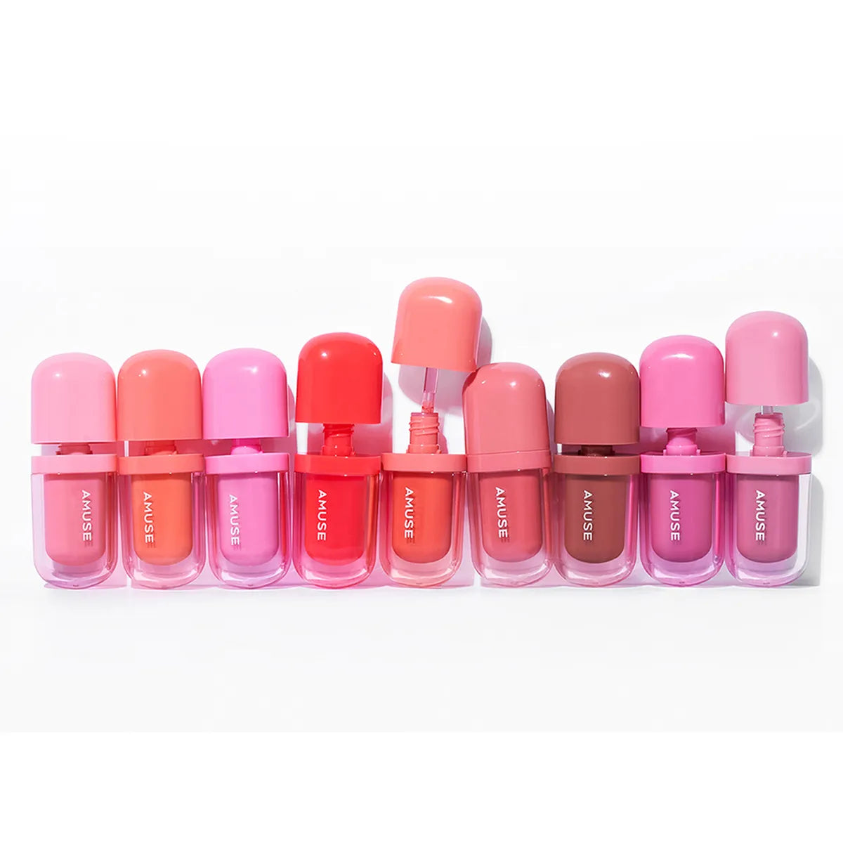 3.8g AMUSE Bebe Tint, a soft pink lip tint for a fresh and radiant appearance.