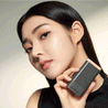 A woman holding a small black box containing CHOSUNGAH BEAUTY Mega Fit Stick Foundation Master SPF50+ PA++++ 16g.