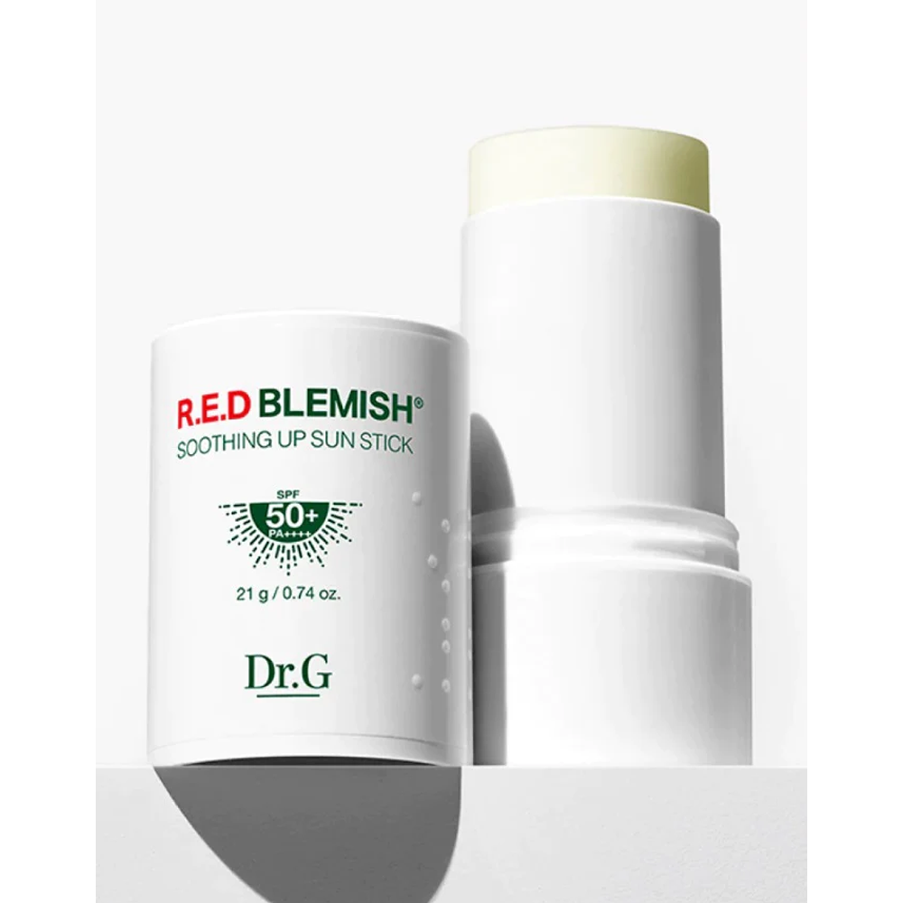 Image of Dr.G R.E.D Blemish Soothing Up Sun Stick in a 21g container. This sun stick provides sun protection while soothing and calming blemish-prone skin. The compact, easy-to-use packaging features the brand name and product details