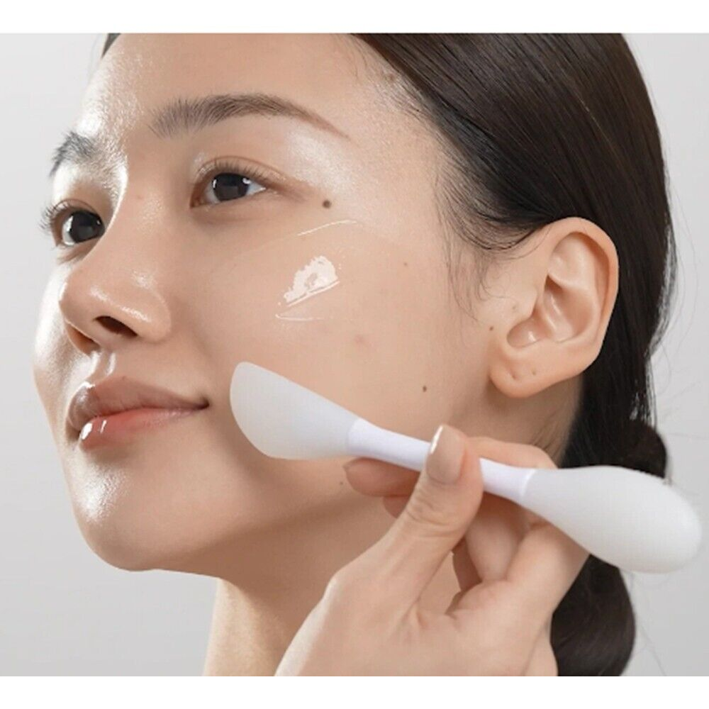 An image of woman promoting the MEDICUBE Collagen Night Wrapping Mask 75ml