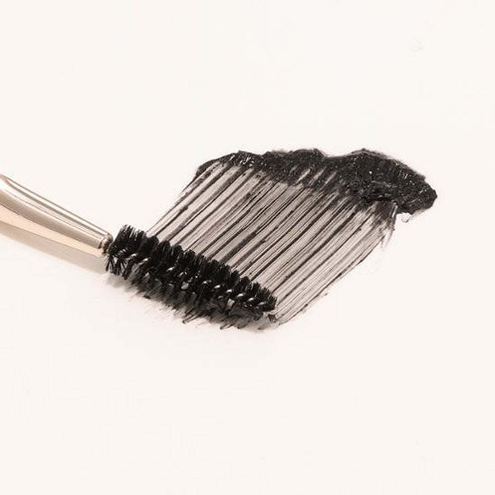 The other end typically has a fine, angled brush or comb, ideal for defining and filling in eyebrows with powders or gels.