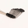 The other end typically has a fine, angled brush or comb, ideal for defining and filling in eyebrows with powders or gels.