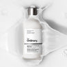 A 100ml bottle of The Ordinary Saccharomyces Ferment 30% Milky Toner, perfect for skincare regimens.