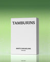 a box of tamburins on a green background