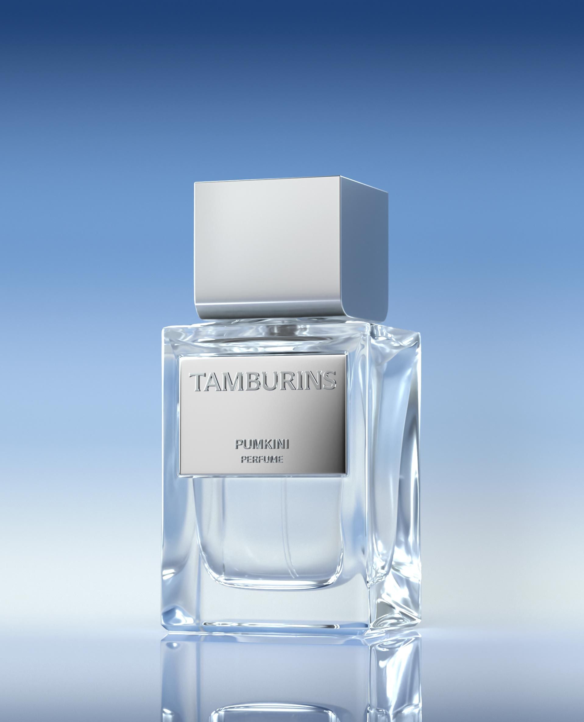 a bottle of TAMBURINS THE EGG PERFUME PUMKINI 50ml perfume sitting on top of a table
