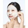 Woman applying the onoma Redness Reliever Tea Tree Calming Gel Mask Set (4+1)