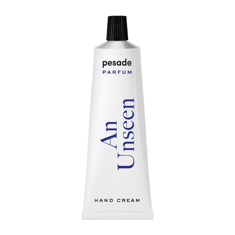 A 50ml tube of Pesade An Unseen Hand Cream, designed for moisturizing and nourishing dry hands effectively.
