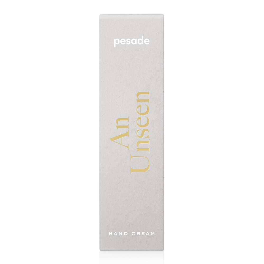 A 50ml container of Pesade An Unseen Hand Cream, formulated to deeply moisturize and protect hands from dryness.