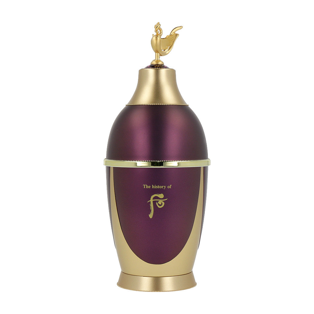 A bottle of The history of whoo Hwanyu Jinaek Essence 50ml, with intricate design and gold accents.